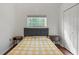 Bedroom with double bed, nightstands, and double door closet at 562 Eagle Pointe S, Kissimmee, FL 34746