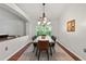 Bright dining room with a modern table and chandelier at 562 Eagle Pointe S, Kissimmee, FL 34746