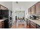 Kitchen with dark wood cabinets, granite countertops, and breakfast nook at 562 Eagle Pointe S, Kissimmee, FL 34746