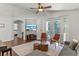 Living area features a large TV and access to the pool at 562 Eagle Pointe S, Kissimmee, FL 34746