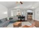 Open living room with views into kitchen and dining areas at 562 Eagle Pointe S, Kissimmee, FL 34746