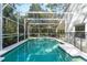 Inviting screened pool with tiled deck at 562 Eagle Pointe S, Kissimmee, FL 34746