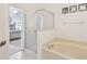 Bathroom features a shower, bathtub, and view of bedroom at 645 Rochester Loop, Davenport, FL 33897