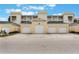 Three-unit building with attached garages and attractive facade at 7501 Mourning Dove Cir # 202, Reunion, FL 34747