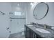 Elegant bathroom with double sinks, granite countertop, and shower at 7901 Dausset St, Orlando, FL 32827