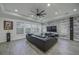 Modern living area with a stone accent wall, comfortable seating, and large windows at 7901 Dausset St, Orlando, FL 32827