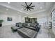 Open-concept living room featuring a large sectional sofa, creating a relaxing atmosphere at 7901 Dausset St, Orlando, FL 32827