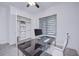 Home office with built-in shelving and large window at 7901 Dausset St, Orlando, FL 32827