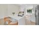 Contemporary kitchen with white cabinets, quartz countertops and island seating at 8244 Limetree Ct, Orlando, FL 32836