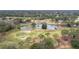 Aerial view of community golf course with ponds and lush landscaping at 9007 Eagle Cove Ct, Orlando, FL 32825