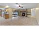 Living room features a stone fireplace and access to a sunroom at 9511 Lake Douglas Pl, Orlando, FL 32817