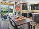 Kitchen dining area with farmhouse table and sliding doors at 998 Nathan Ridge Rd, Clermont, FL 34715