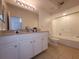 Clean bathroom with a shower/tub combo and double vanity at 12216 Wild Iris Way # 112, Orlando, FL 32837