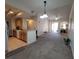 Spacious living room with high ceilings, carpet flooring, and access to a balcony at 12216 Wild Iris Way # 112, Orlando, FL 32837