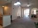 Spacious living room with high ceilings, carpet flooring, and access to a balcony at 12216 Wild Iris Way # 112, Orlando, FL 32837