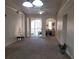 Spacious living room with high ceilings, carpet flooring, and access to a balcony at 12216 Wild Iris Way # 112, Orlando, FL 32837