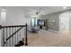 Upstairs loft with a sofa, TV stand, and access to a bathroom at 12545 Charmed Dr, Winter Garden, FL 34787