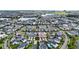 Aerial view of a townhome community near a lake at 13444 Stoddart Ave, Orlando, FL 32827