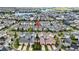 Aerial view of a townhome community near a lake at 13444 Stoddart Ave, Orlando, FL 32827