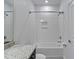 Clean bathroom with a shower/tub combo and white tile at 13444 Stoddart Ave, Orlando, FL 32827