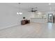 Bright dining room with tile floors and modern chandelier at 13444 Stoddart Ave, Orlando, FL 32827