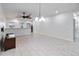 Bright dining room with tile floors and modern chandelier at 13444 Stoddart Ave, Orlando, FL 32827