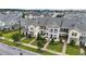 Two-story townhome with landscaping and brick walkway at 13444 Stoddart Ave, Orlando, FL 32827