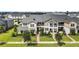 Two-story townhome with landscaping and brick walkway at 13444 Stoddart Ave, Orlando, FL 32827