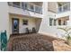 Private patio with brick pavers and rocking chairs at 13444 Stoddart Ave, Orlando, FL 32827