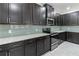Modern kitchen with dark cabinets and granite countertops at 13444 Stoddart Ave, Orlando, FL 32827