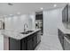 Modern kitchen with stainless steel appliances and granite countertops at 13444 Stoddart Ave, Orlando, FL 32827