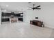 Open living room and kitchen with modern tile floors at 13444 Stoddart Ave, Orlando, FL 32827