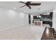 Open living room and kitchen with modern tile floors at 13444 Stoddart Ave, Orlando, FL 32827
