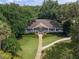 Aerial shot of a sprawling house with a large front yard, walkway, and inviting front porch at 136 Woodmill Rd, Longwood, FL 32779