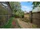 Charming backyard space with lush greenery and beautiful plants, perfect for relaxation at 136 Woodmill Rd, Longwood, FL 32779