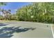 Outdoor basketball court surrounded by lush greenery at 136 Woodmill Rd, Longwood, FL 32779