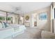 Bright bedroom with an ensuite bathroom, mirrored closet, and backyard views at 136 Woodmill Rd, Longwood, FL 32779