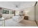 Bright bedroom features a ceiling fan, two windows and carpeted floors at 136 Woodmill Rd, Longwood, FL 32779