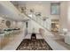 Open concept dining area with stairs, a bar, and tiled floors for entertaining at 136 Woodmill Rd, Longwood, FL 32779