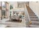 Stately entrance foyer with a staircase and views of the dining and living areas at 136 Woodmill Rd, Longwood, FL 32779