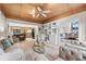 Spacious living room boasts wood ceiling, built-in shelving, and seamless flow to the dining area at 136 Woodmill Rd, Longwood, FL 32779
