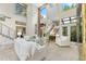 Elegant living room with soaring ceilings, statement windows, and ample natural light at 136 Woodmill Rd, Longwood, FL 32779