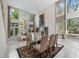 Bright open concept living room featuring high ceilings, large windows, lots of natural light and luxury furniture at 136 Woodmill Rd, Longwood, FL 32779