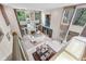 Expansive living room featuring soaring ceilings, grand staircase, and floor-to-ceiling windows at 136 Woodmill Rd, Longwood, FL 32779