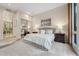 Relaxing main bedroom with plush carpet, soft lighting, and decorative wall art at 136 Woodmill Rd, Longwood, FL 32779