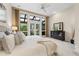 Relaxing main bedroom with large windows, ceiling fan, plush carpet and dark wood dresser at 136 Woodmill Rd, Longwood, FL 32779