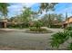 A beautiful roundabout with manicured landscaping and well-maintained homes in a peaceful neighborhood at 136 Woodmill Rd, Longwood, FL 32779