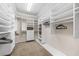 Well-organized walk-in closet with ample shelving and hanging space for storage at 136 Woodmill Rd, Longwood, FL 32779