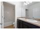 Clean bathroom features a double vanity, tile flooring, and a shower/tub combination, perfect for relaxation at 1504 Finchburg St, Minneola, FL 34715