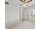 Spacious bedroom with a ceiling fan, white walls, and natural light from a window at 1504 Finchburg St, Minneola, FL 34715